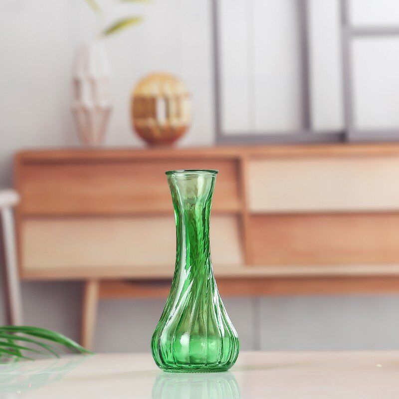 Handblown glass bud vase with fluted neck and weighted base