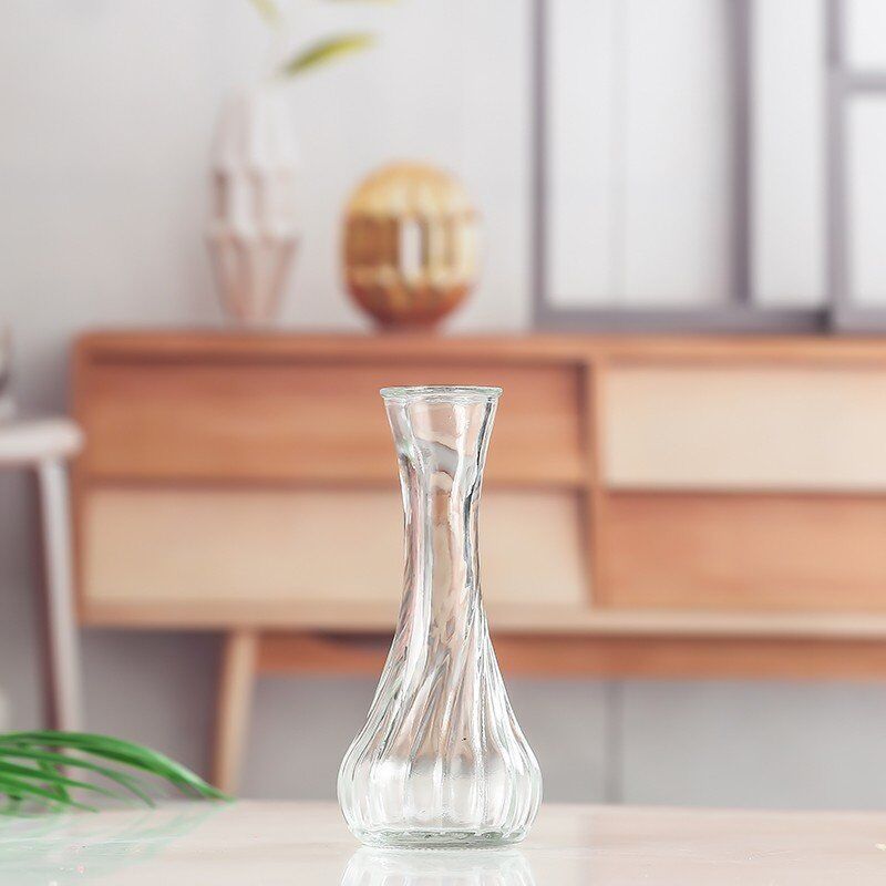 Handblown glass bud vase with fluted neck and weighted base
