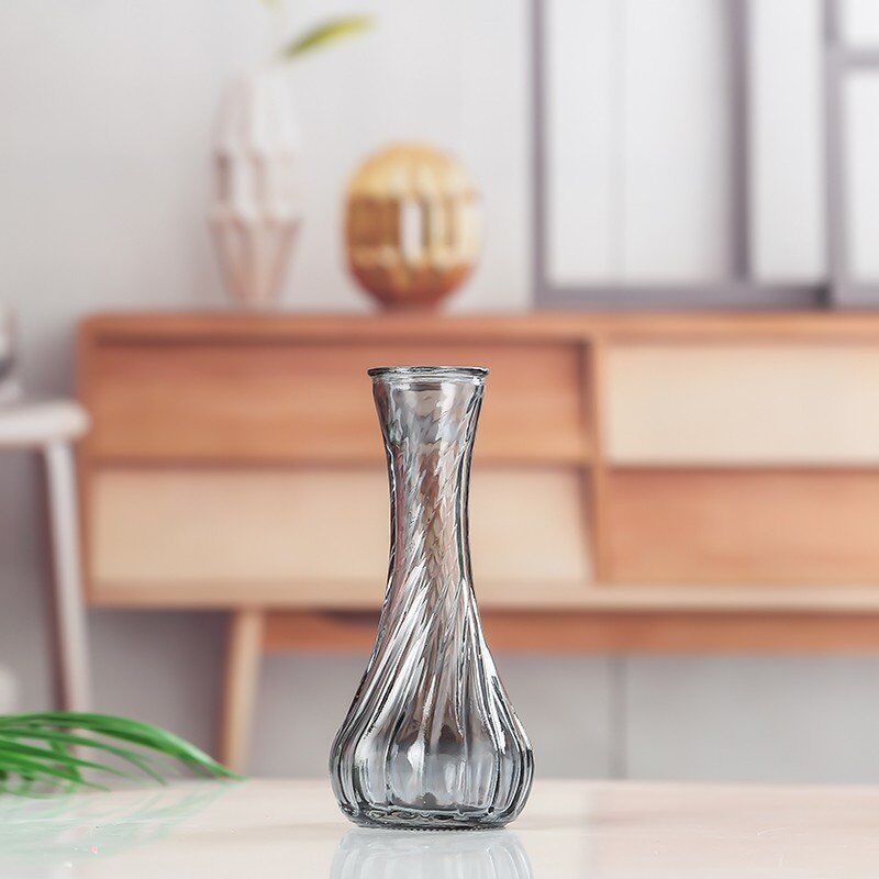 Handblown glass bud vase with fluted neck and weighted base