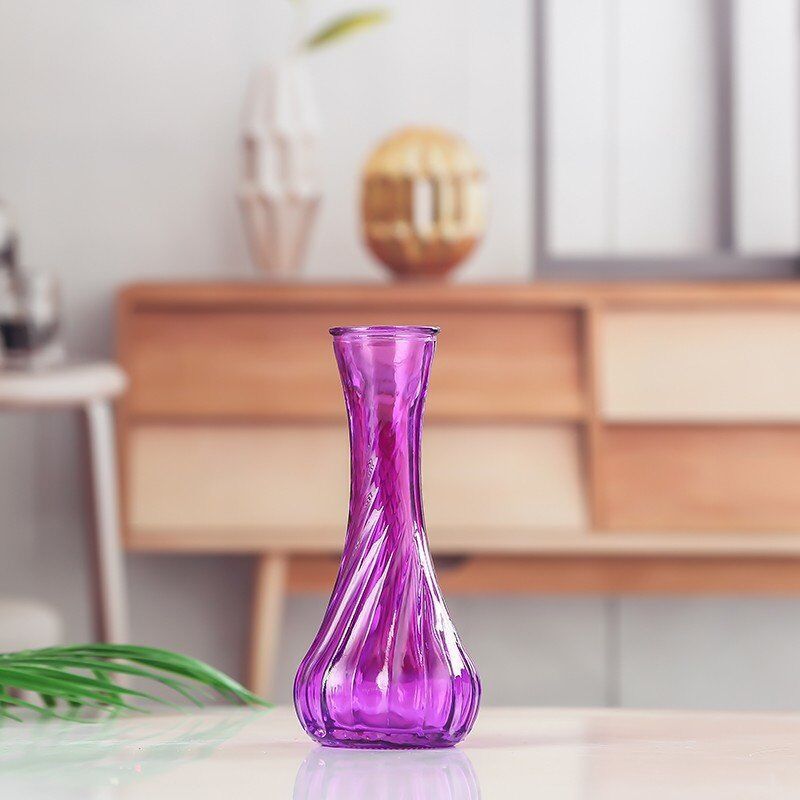Handblown glass bud vase with fluted neck and weighted base
